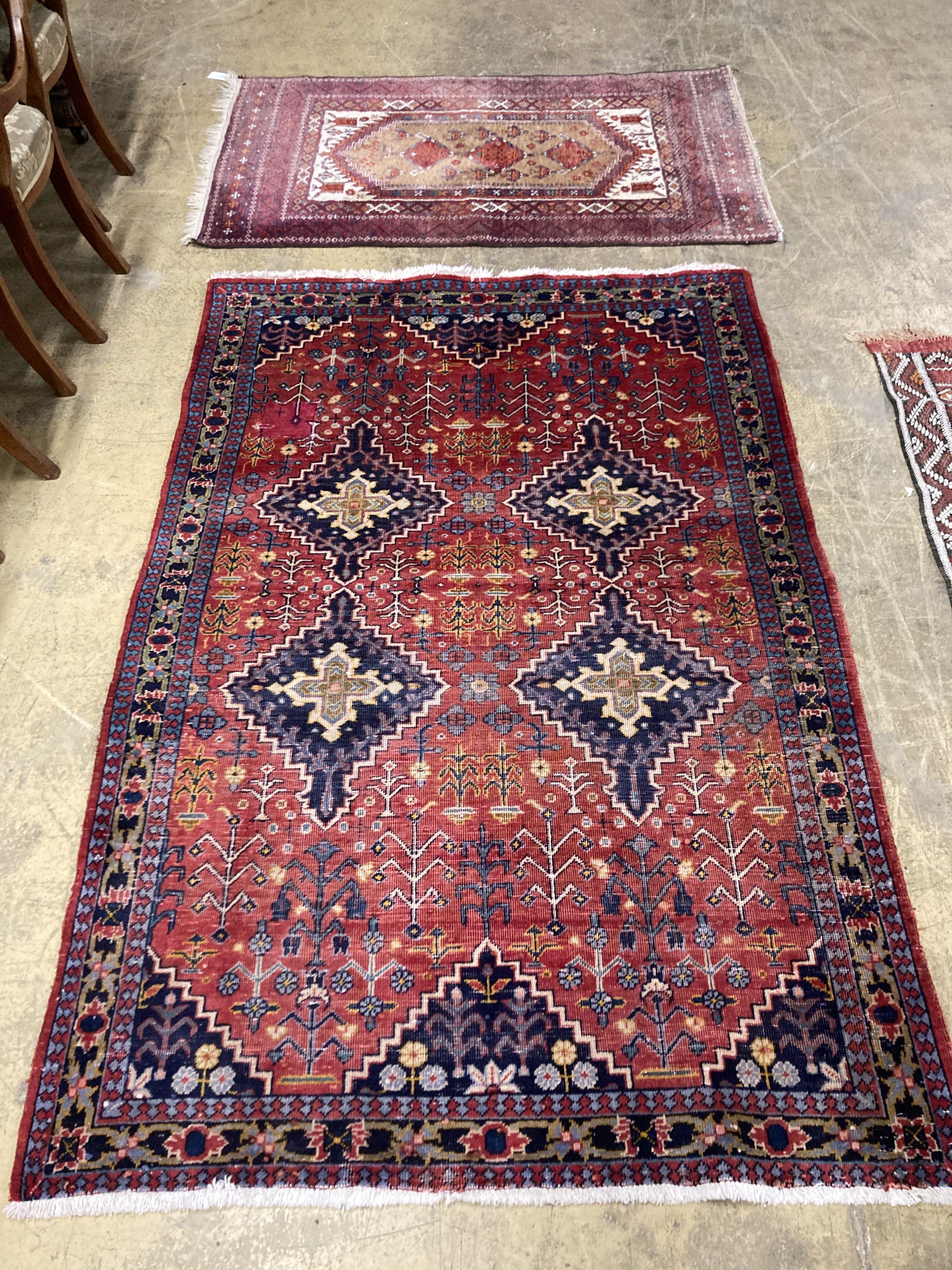 A Caucasian design red ground rug, 206 x 134cm together with a smaller West Persian design rug